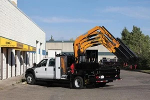 Truck featuring a DEL Equipment custom designed body with Effer crane
